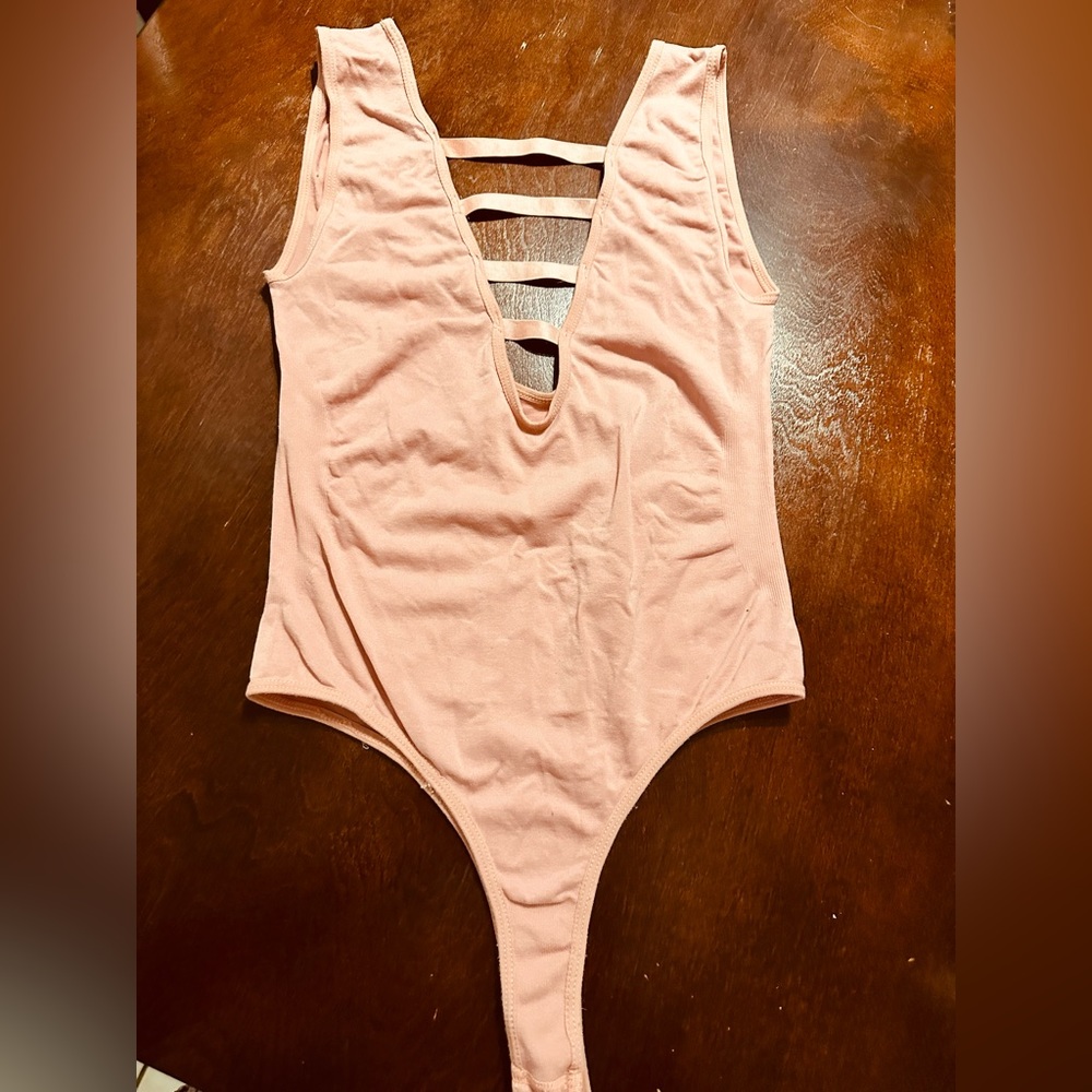Rose colored body suit